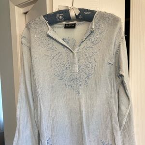 100 percent cotton, baby blue hippie shirt made in India.